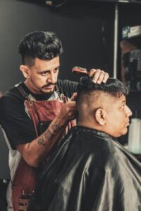 barber cutting man s hair