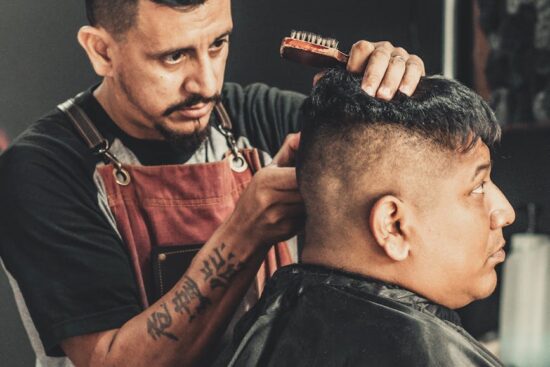 barber cutting man s hair