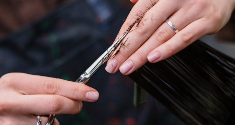 person holding silver and black pen