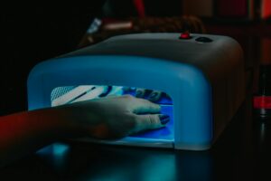 a person s hand inside the uv lamp